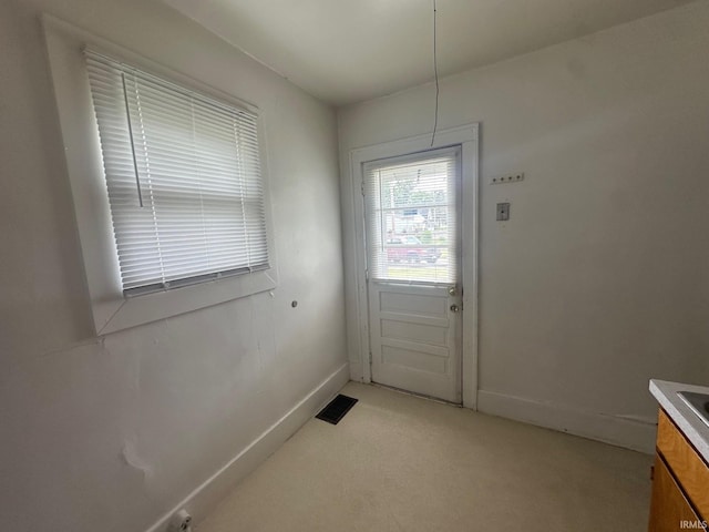 237 Stanley St, Mishawaka, IN 46545 - doorway with light carpet and baseboards