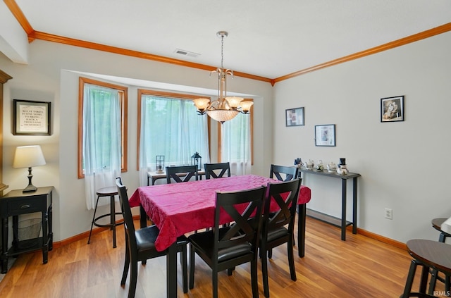 1322 Canal Ridge Dr, New Haven, IN 46774 - dining area with a chandelier, crown molding, and wood finished floors