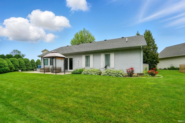 1322 Canal Ridge Dr, New Haven, IN 46774 - rear view of house with a patio, an outdoor living space, a gazebo, a yard, and a shingled roof