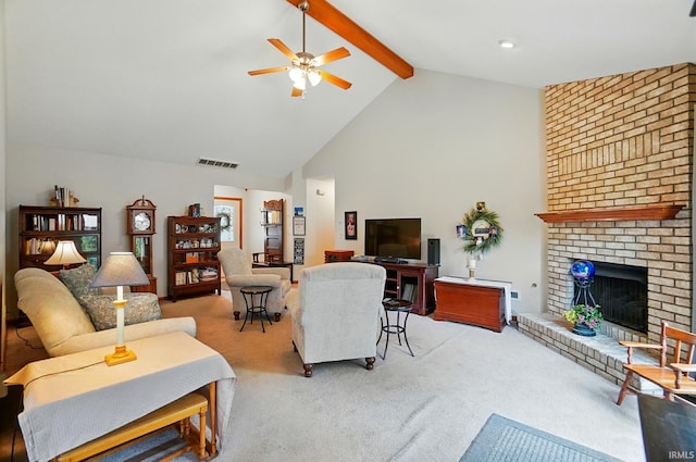 1322 Canal Ridge Dr, New Haven, IN 46774 - carpeted living room with beamed ceiling, a ceiling fan, a fireplace, and high vaulted ceiling