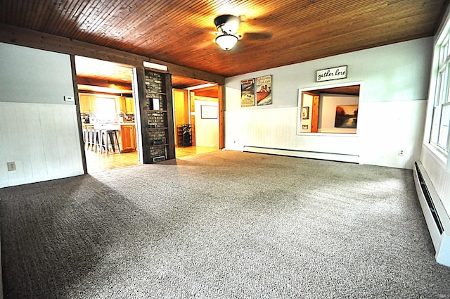8077 E State Road 4th Rd, Walkerton, IN 46574 - spare room featuring baseboard heating, wooden walls, wainscoting, and wooden ceiling