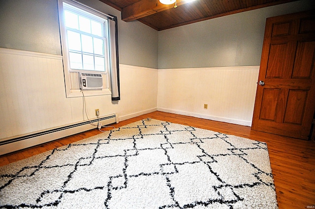8077 E State Road 4th Rd, Walkerton, IN 46574 - spare room featuring a wainscoted wall, wood ceiling, cooling unit, wood finished floors, and a baseboard radiator