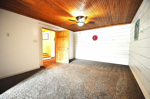 8077 E State Road 4th Rd, Walkerton, IN 46574 - spare room featuring wood ceiling, ceiling fan, wood walls, and carpet flooring