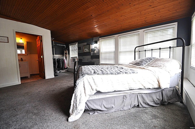 8077 E State Road 4th Rd, Walkerton, IN 46574 - carpeted bedroom with wood ceiling, multiple windows, a spacious closet, a closet, and ensuite bathroom