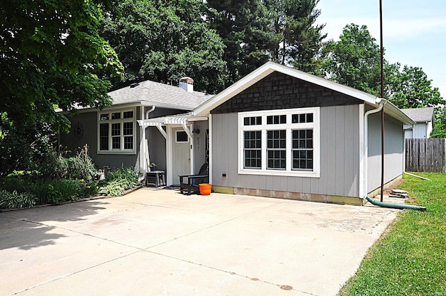 8077 E State Road 4th Rd, Walkerton, IN 46574 - view of front facade with a patio area and a chimney
