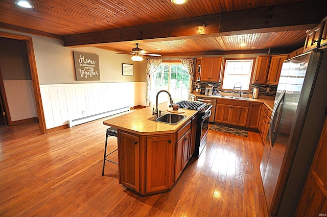 8077 E State Road 4th Rd, Walkerton, IN 46574 - kitchen featuring a baseboard radiator, freestanding refrigerator, a wooden ceiling with exposed beams, brown cabinets, and a ceiling fan