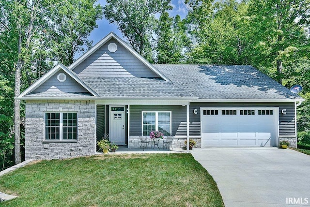 5107 Weathers Ct, Bloomington, IN 47404 - view of front of house with stone siding, an attached garage, a shingled roof, and a front lawn