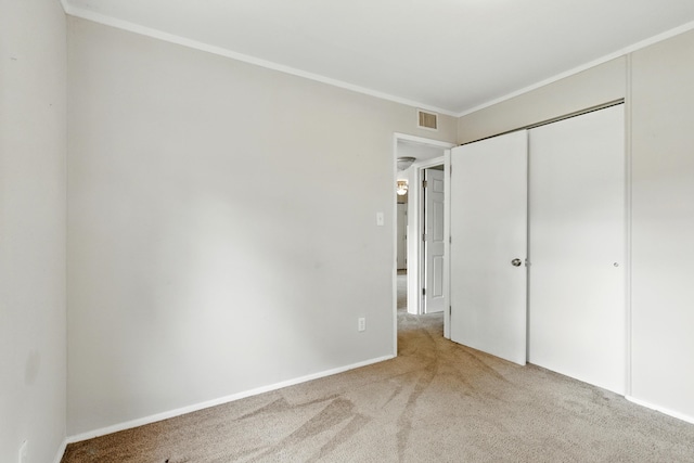 1610 Kentucky Ave, Fort Wayne, IN 46805 - unfurnished bedroom featuring carpet floors, ornamental molding, and a closet
