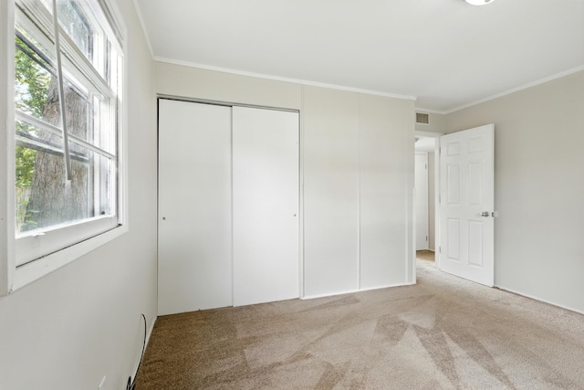 1610 Kentucky Ave, Fort Wayne, IN 46805 - unfurnished bedroom with carpet, a closet, and crown molding