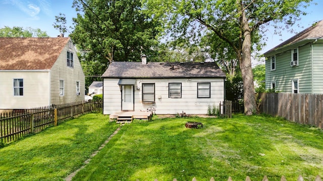 1610 Kentucky Ave, Fort Wayne, IN 46805 - rear view of house with an outdoor fire pit and a fenced backyard