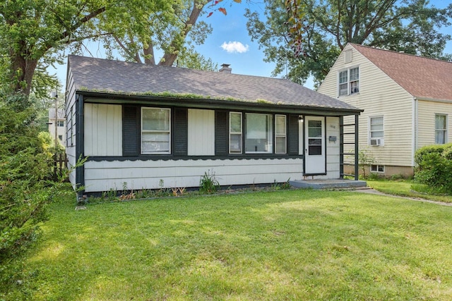 1610 Kentucky Ave, Fort Wayne, IN 46805 - view of front facade with a front lawn, a chimney, roof with shingles, and cooling unit