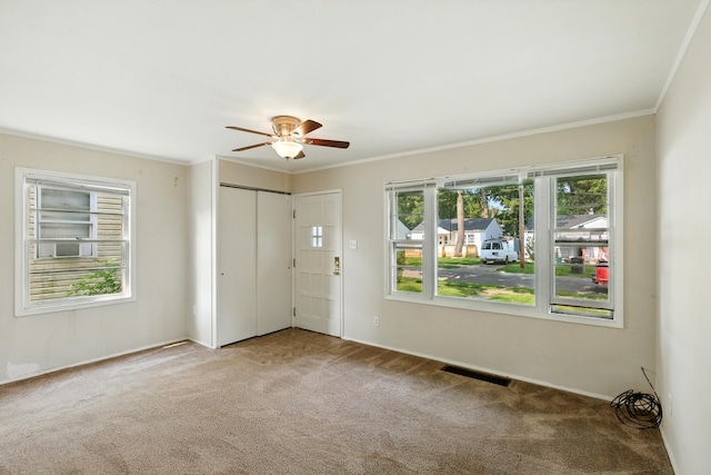 1610 Kentucky Ave, Fort Wayne, IN 46805 - carpeted spare room featuring plenty of natural light, a ceiling fan, and crown molding