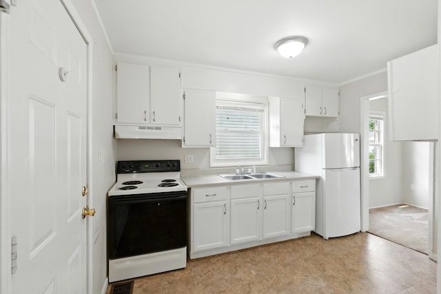 1610 Kentucky Ave, Fort Wayne, IN 46805 - kitchen featuring range with electric stovetop, freestanding refrigerator, under cabinet range hood, and white cabinetry