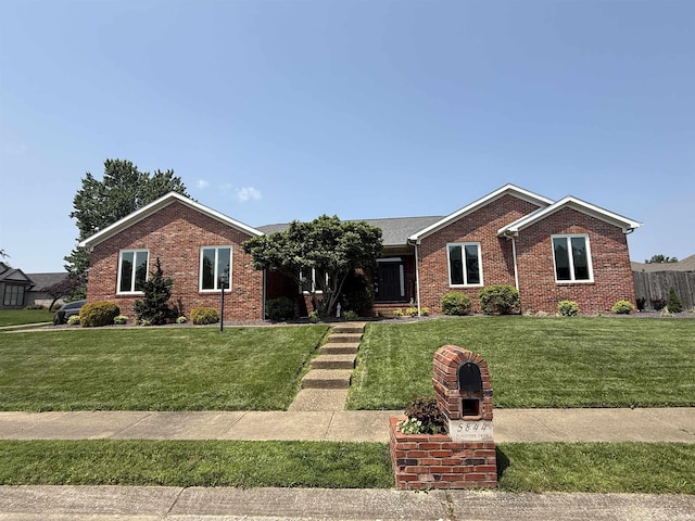 5844 Flagstone Dr, Evansville, IN 47711 - ranch-style home featuring brick siding and a front yard