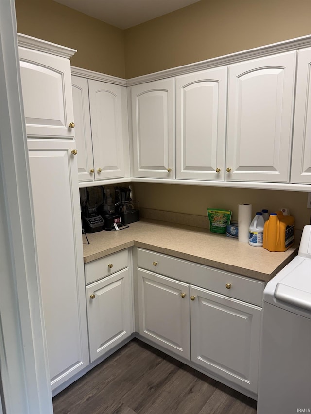 5844 Flagstone Dr, Evansville, IN 47711 - washroom with washer / dryer, cabinet space, and dark wood-style flooring