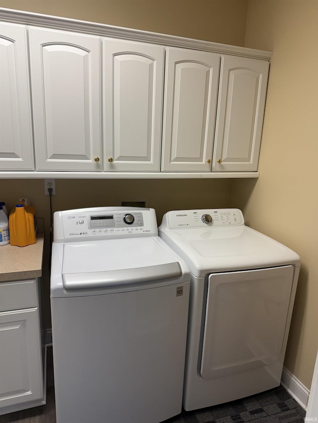 5844 Flagstone Dr, Evansville, IN 47711 - laundry area featuring independent washer and dryer and cabinet space