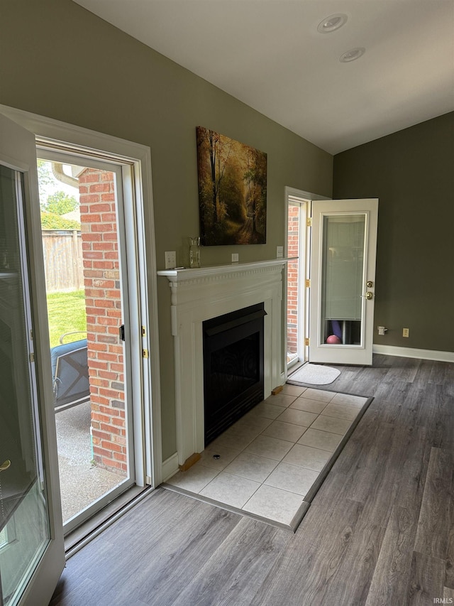 5844 Flagstone Dr, Evansville, IN 47711 - unfurnished living room featuring wood finished floors and a fireplace