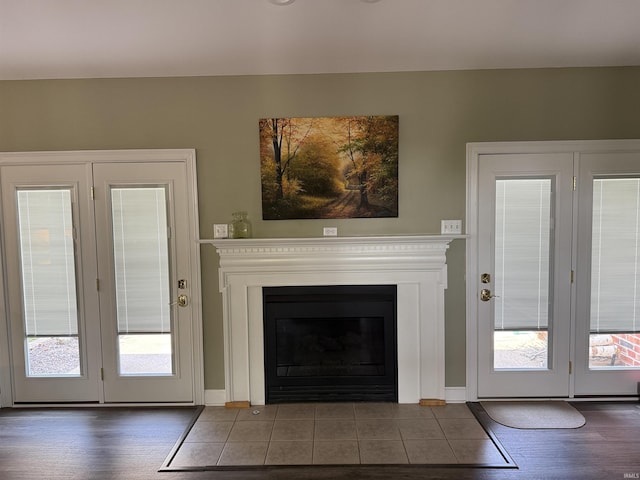 5844 Flagstone Dr, Evansville, IN 47711 - unfurnished living room with healthy amount of natural light, a fireplace with flush hearth, and tile patterned floors
