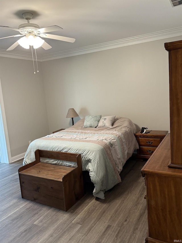5844 Flagstone Dr, Evansville, IN 47711 - bedroom with wood finished floors, crown molding, and ceiling fan