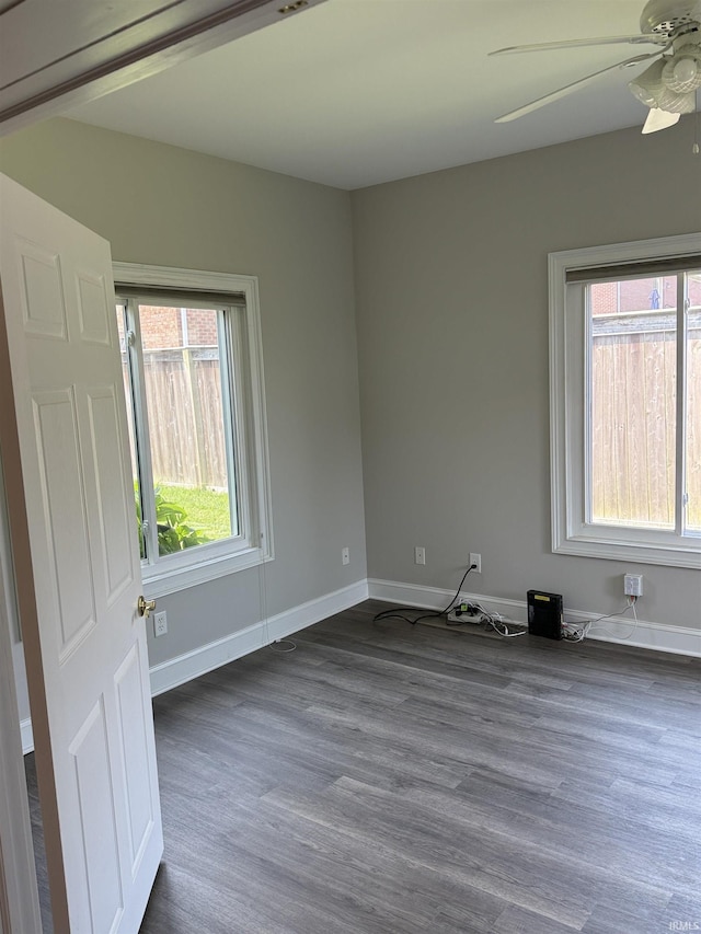 5844 Flagstone Dr, Evansville, IN 47711 - unfurnished room with dark wood-style flooring and a ceiling fan