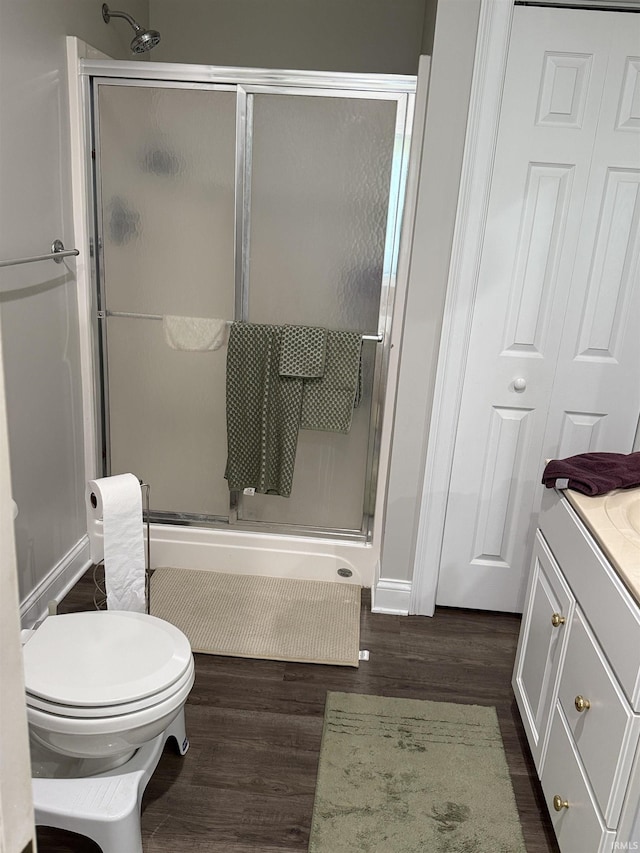5844 Flagstone Dr, Evansville, IN 47711 - bathroom featuring wood finished floors, a stall shower, and vanity