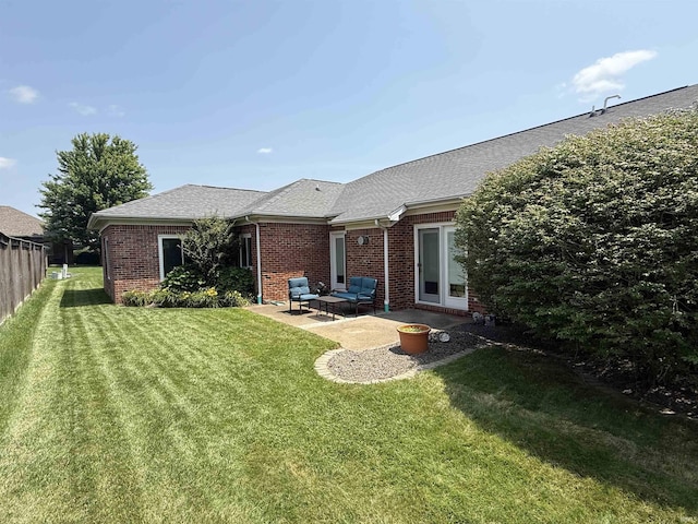 5844 Flagstone Dr, Evansville, IN 47711 - rear view of property with brick siding, a patio area, a lawn, and a shingled roof