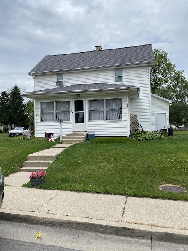 506 N Sprunger St, Berne, IN 46711 - view of front of house with entry steps, a front lawn, and roof with shingles