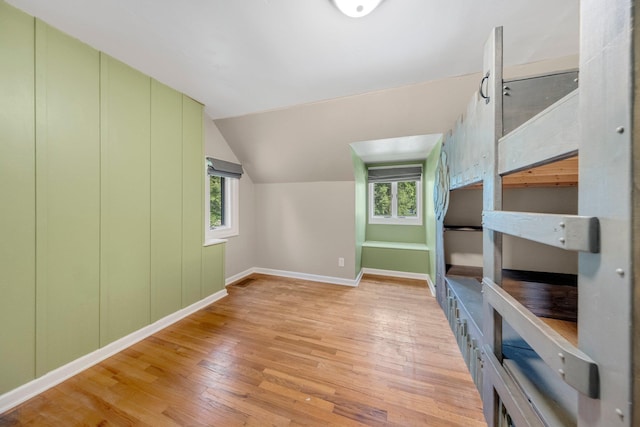 1402 Jackson Rd, South Bend, IN 46614 - unfurnished bedroom featuring light wood finished floors and vaulted ceiling