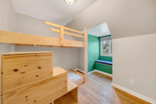 1402 Jackson Rd, South Bend, IN 46614 - unfurnished bedroom with vaulted ceiling and light wood-type flooring