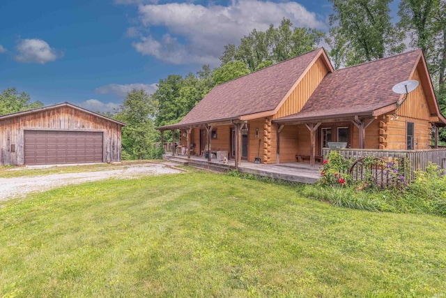 1275 N Sewell Rd, Bloomington, IN 47408 - log home with a front yard, a detached garage, a shingled roof, an outdoor structure, and log exterior