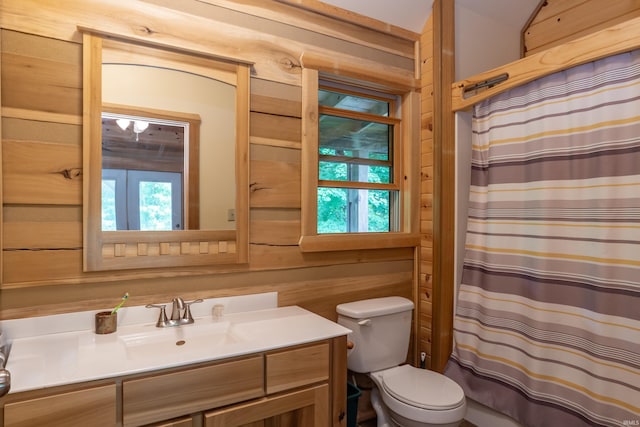 1275 N Sewell Rd, Bloomington, IN 47408 - bathroom with wooden walls, vanity, and a shower with shower curtain