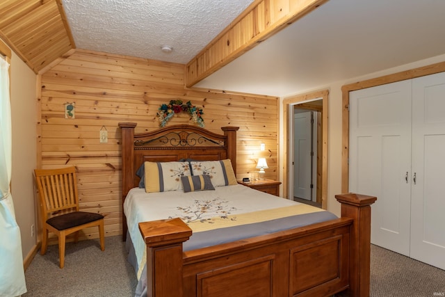 1275 N Sewell Rd, Bloomington, IN 47408 - carpeted bedroom with wood walls and a textured ceiling