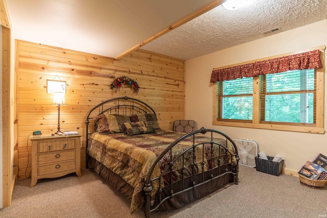 1275 N Sewell Rd, Bloomington, IN 47408 - bedroom with carpet floors, wood walls, and a textured ceiling