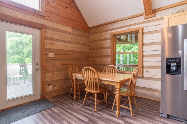 1275 N Sewell Rd, Bloomington, IN 47408 - dining space with lofted ceiling, wood walls, and wood finished floors
