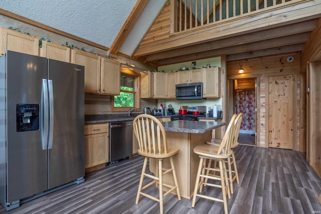 1275 N Sewell Rd, Bloomington, IN 47408 - kitchen with stainless steel appliances, light brown cabinets, dark countertops, dark wood-type flooring, and a kitchen island