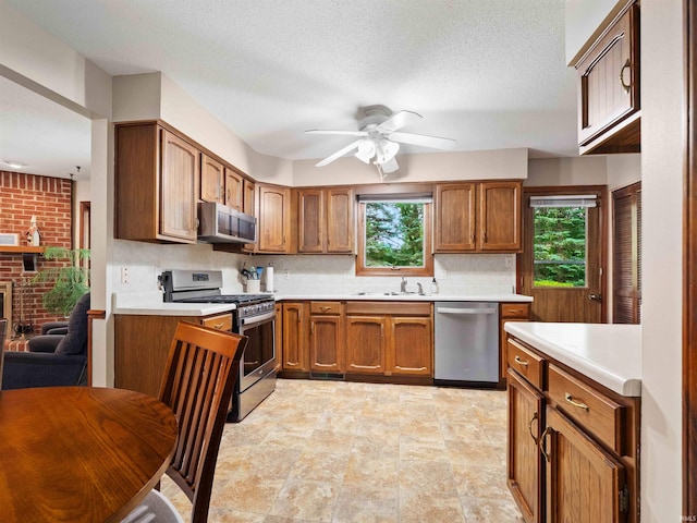 3723 Pebblewood Pl, Fort Wayne, IN 46804 - kitchen with stainless steel appliances, ceiling fan, plenty of natural light, and light countertops