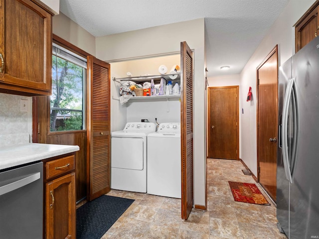 3723 Pebblewood Pl, Fort Wayne, IN 46804 - washroom featuring stone finish floors and washing machine and clothes dryer