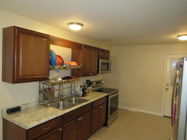 219 Fulton Ave, Rochester, IN 46975 - kitchen with appliances with stainless steel finishes, light countertops, and open shelves