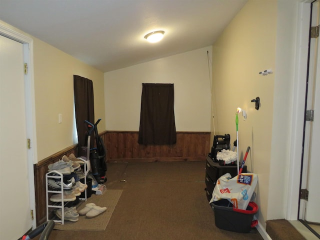 219 Fulton Ave, Rochester, IN 46975 - rec room featuring a wainscoted wall, wooden walls, carpet floors, and lofted ceiling