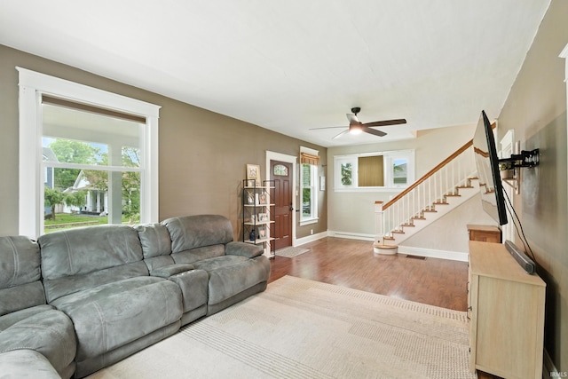 319 W Wiley Ave, Bluffton, IN 46714 - living area featuring wood finished floors, ceiling fan, and stairs