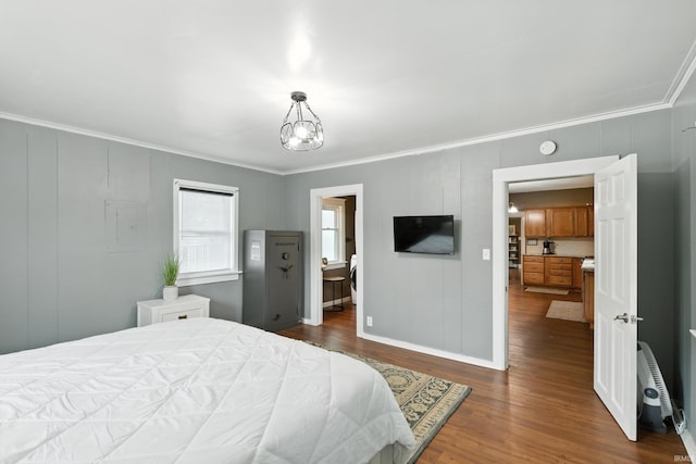 319 W Wiley Ave, Bluffton, IN 46714 - bedroom with ornamental molding, dark wood finished floors, and a chandelier