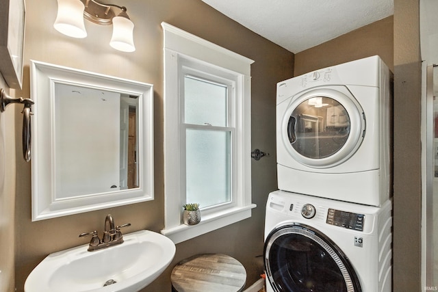 319 W Wiley Ave, Bluffton, IN 46714 - bathroom featuring stacked washing machine and dryer and a sink