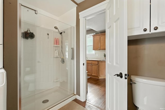 319 W Wiley Ave, Bluffton, IN 46714 - bathroom featuring a shower stall, vanity, and wood finished floors