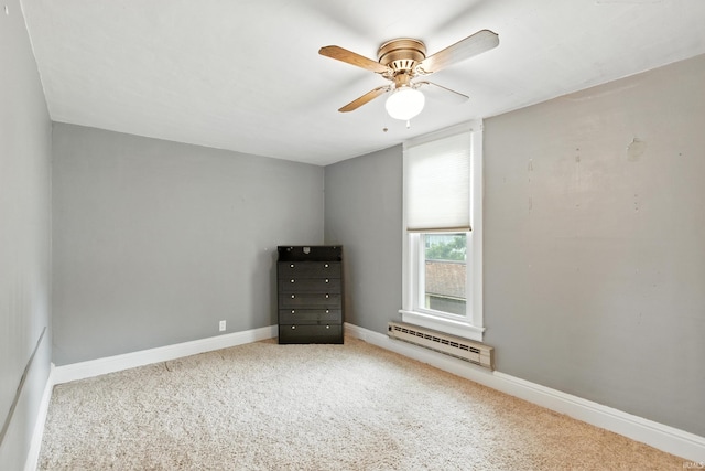 319 W Wiley Ave, Bluffton, IN 46714 - unfurnished bedroom with carpet floors, baseboard heating, and a ceiling fan