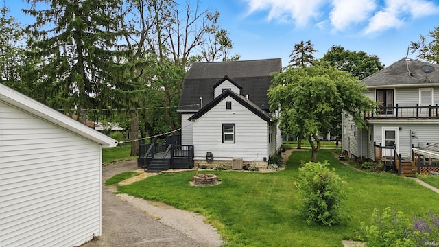 319 W Wiley Ave, Bluffton, IN 46714 - view of property exterior with a fire pit, a yard, and a deck