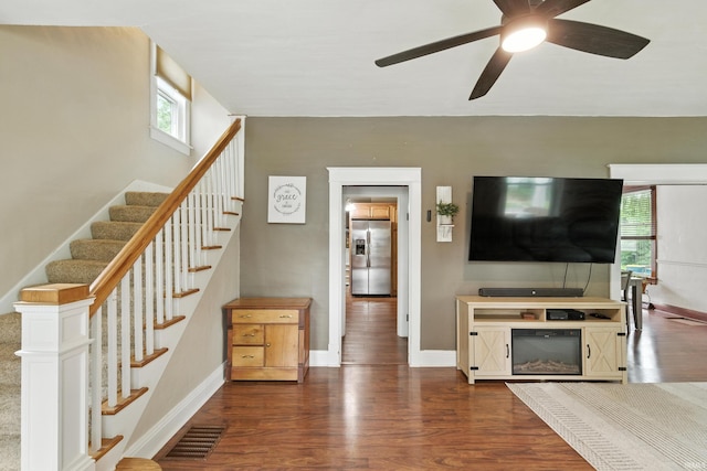 319 W Wiley Ave, Bluffton, IN 46714 - living area featuring dark wood finished floors, plenty of natural light, and stairway