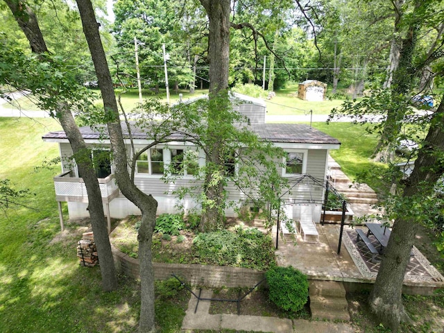 3643 S Bruner Rd, Warsaw, IN 46580 - rear view of property featuring a wooden deck, a lawn, and view of scattered trees