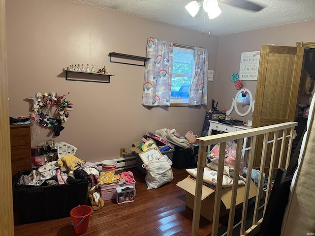 2286 N County Road 200 W, New Castle, IN 47362 - bedroom with hardwood / wood-style floors, a textured ceiling, and ceiling fan