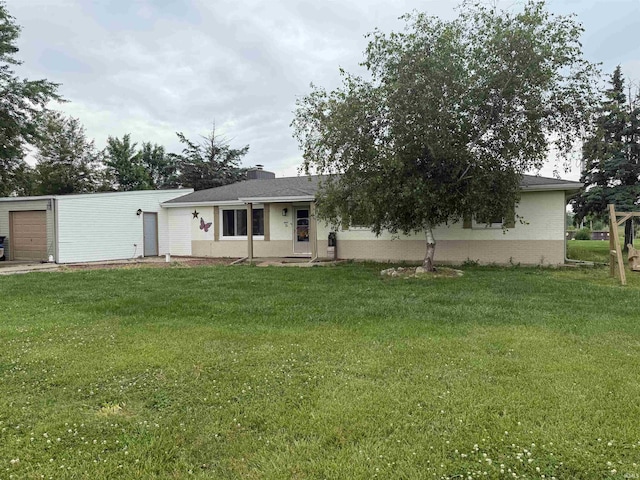 2286 N County Road 200 W, New Castle, IN 47362 - view of front of property with a front yard, a garage, and brick siding