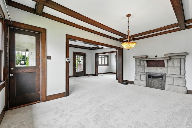 501 E Center St, Warsaw, IN 46580 - unfurnished living room featuring carpet, beam ceiling, a fireplace, and coffered ceiling